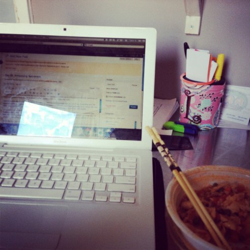 This is the life: Macbook, a messy desk, and cheap Thai.